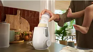 Warm bottles in 3 minutes with one button*